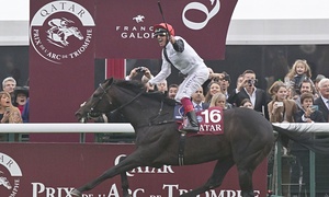 Frankie Dettori honors on board Golden Horn after winning the Prix de l’Arc de Triomphe at Longchamp.